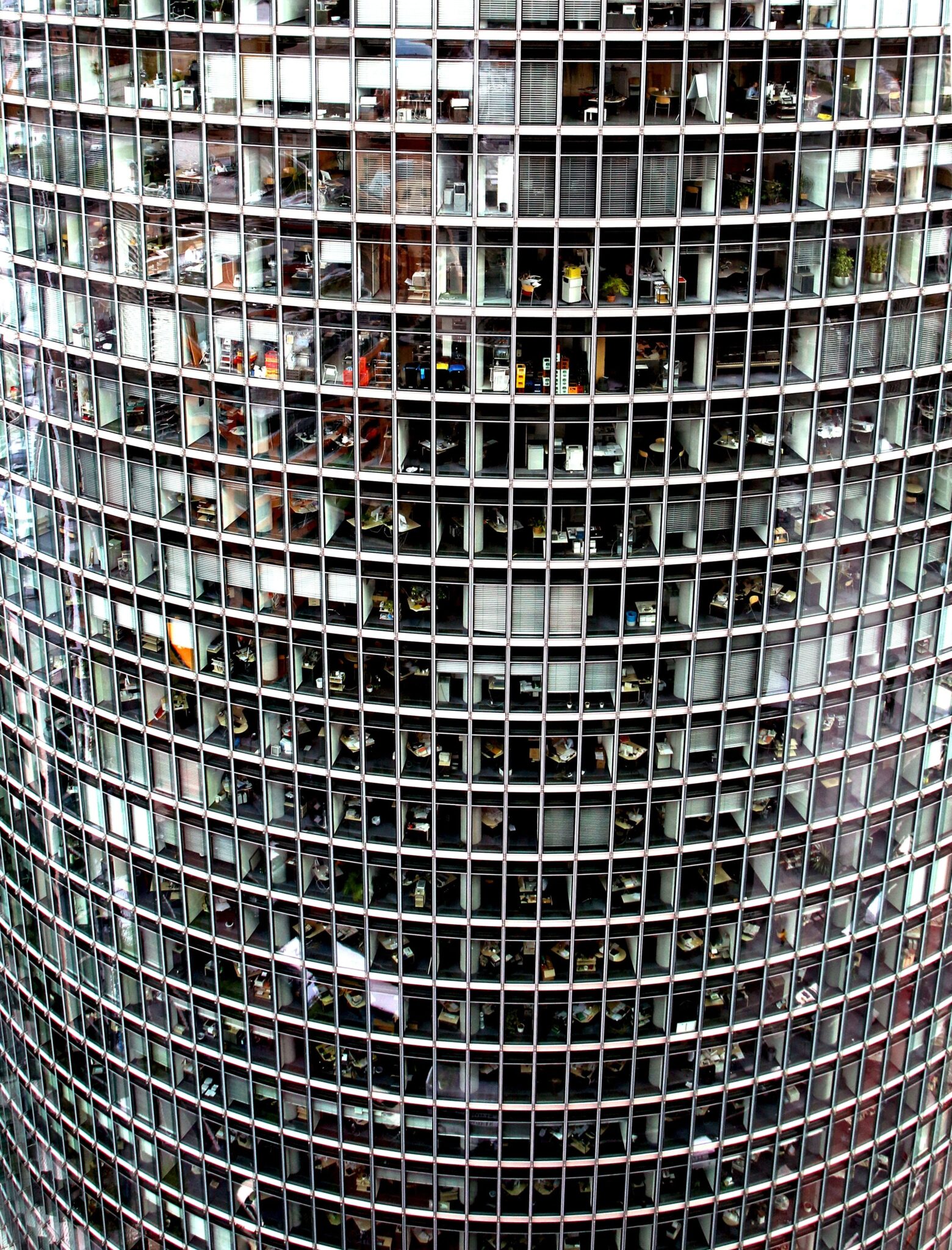 Close-up of a modern high-rise office building façade with grid-patterned windows.